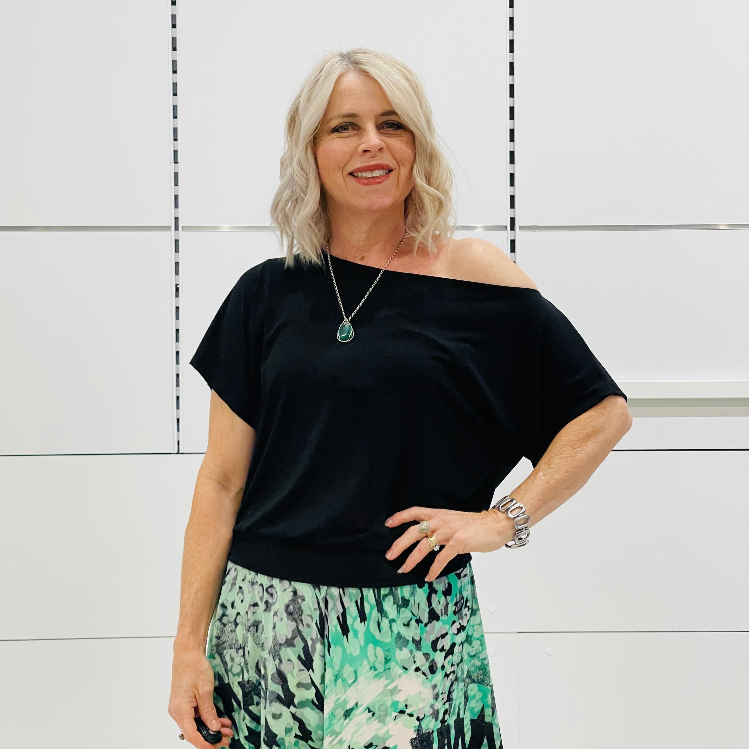Black, asymmetrical neckline, relaxed fit top.