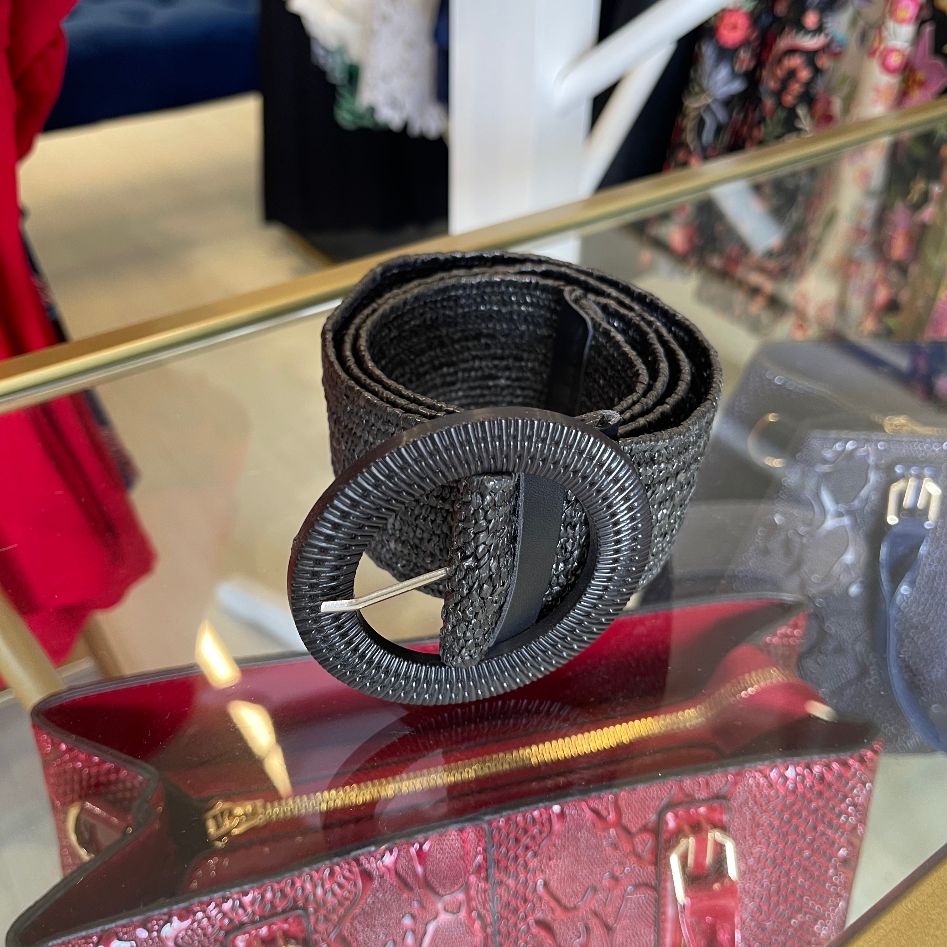 Black rattan, stretchy women's belt, 90 cm long, round buckle with silver coloured prong.