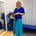 Woman wearing blue top and green skirt 