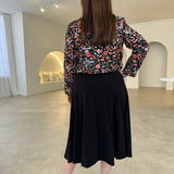 Black short, bolero jacket with all over multi coloured embroidery.With black dress.