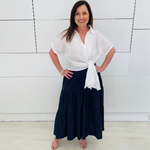 Navy Linen Tiered 7/8s length Skirt. White Linen shirt with short sleeves and side tie detail.