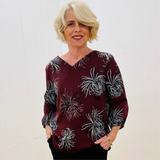 Women's v neckline, 3/4 length gathered sleeve, relaxed fit, floral print top, in colours, reddish brown,white and pale pink flowers 