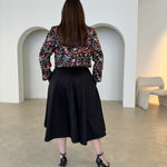 Black short, bolero jacket with all over multi coloured embroidery.With strapless  dress.