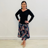 Black bamboo, long sleeved  top with v neckline. Autumn Radiance Aline Skirt with a leaf print in white, reds, teals, navy and black midi length skirt made in a stretch jersey flat discreet elastic through waistband.