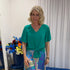 Woman wearing Harper top green and colourful skirt 
