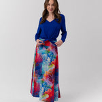 Woman wearing blue bamboo top and maxi skirt