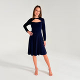 Woman wearing a navy blue dress with long sleeves on a white background