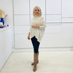 Cream knit jumper/sweater.Long sleeve, high neckline, asymmetrical hemline woolen winter jumper.