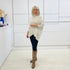 Cream knit jumper/sweater.Long sleeve, high neckline, asymmetrical hemline woolen winter jumper.
