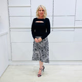Noir garden-Black and white floral print, Rachel  Ruffle skirt, with elastic stretch waist. Worn on model with black bamboo , long sleeve, split front, Sabrina top. 