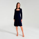 Woman wearing a Navy Blue dress on a white background