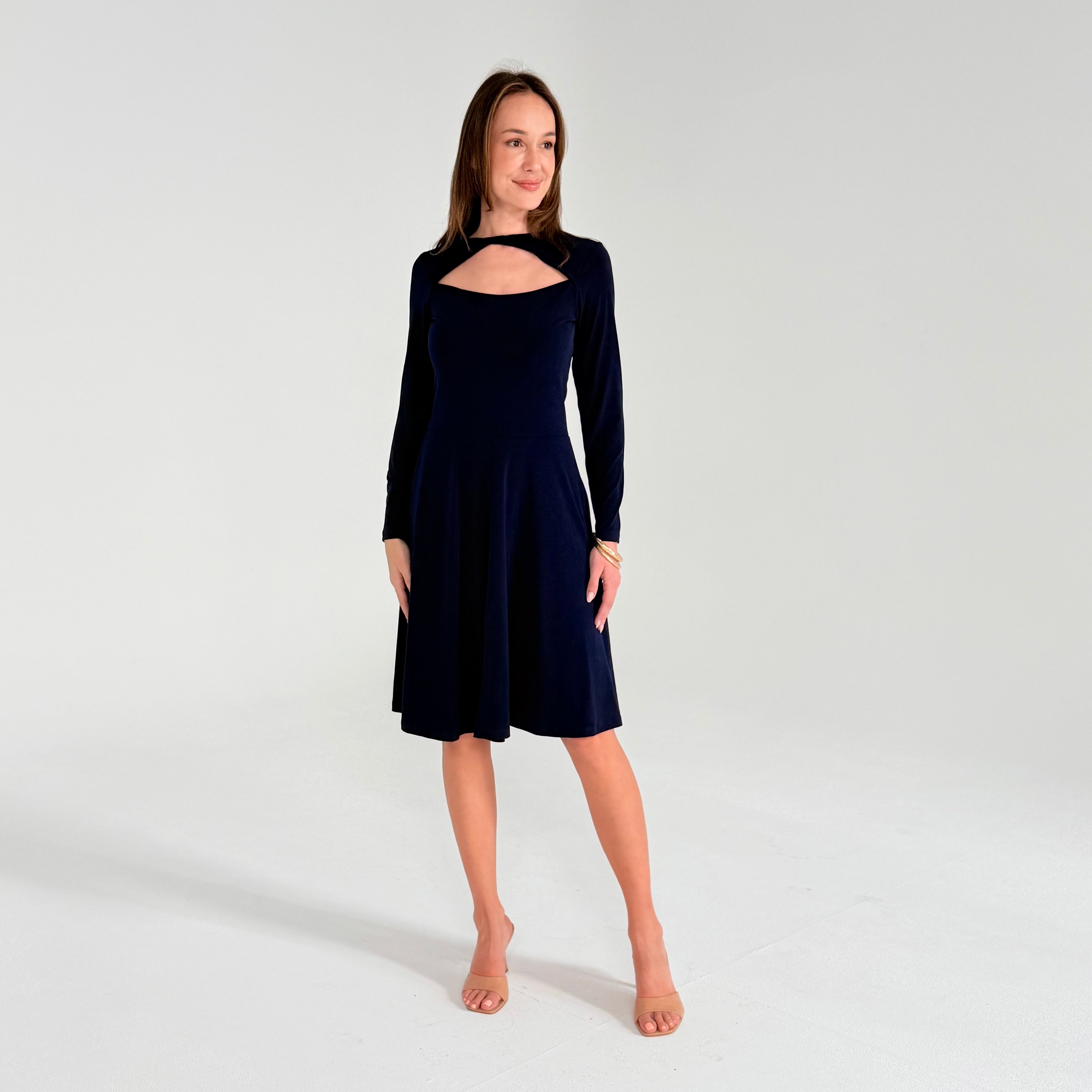 Woman wearing a Navy Blue dress on a white background