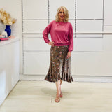 Relaxed, loose line fit top, long sleeve,with wrist cuff, round neck, waistband for shape. With soft drape midi length, brown floral skirt with soft ruffle on asymmetrical hemline.