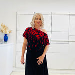 Black & red floral print, off the shoulder, asymmetrical neckline, relaxed fit top, worn with black, handkerchief hemline skirt with elastic waistband.