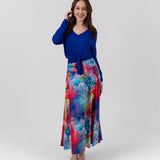 Model wearing Harpo Top and Maxi skirt in white room 