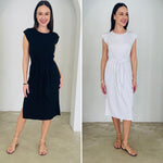 Side-by-side comparison of a woman wearing a black dress and a white dress against a plain background.
