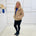 Tan fluffy, faux fur, teddy bear, Bailey Jacket, with pockets, worn with tailored fitted black pants and cobalt blue, relaxed fit, bamboo top. 