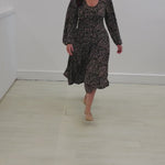 Black, beige & cream patterned stretch dress, with scoop neckline, long puff sleeve, paneled flared, midi length dress.