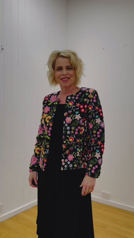 Black silk floral embroidered in colours of pink, green,red, blue, beige,fully lined tailored women's jacket.