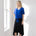 Model wearing blue top and black midi eclipse skirt