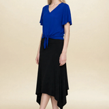 Model wearing blue top and black midi eclipse skirt