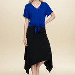 Model wearing blue top and black midi eclipse skirt