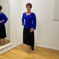 Black viscose spandex midi length skirt dipped panel in side seam. Flat stretch waistband. True Reflections Clothing Gymea.
