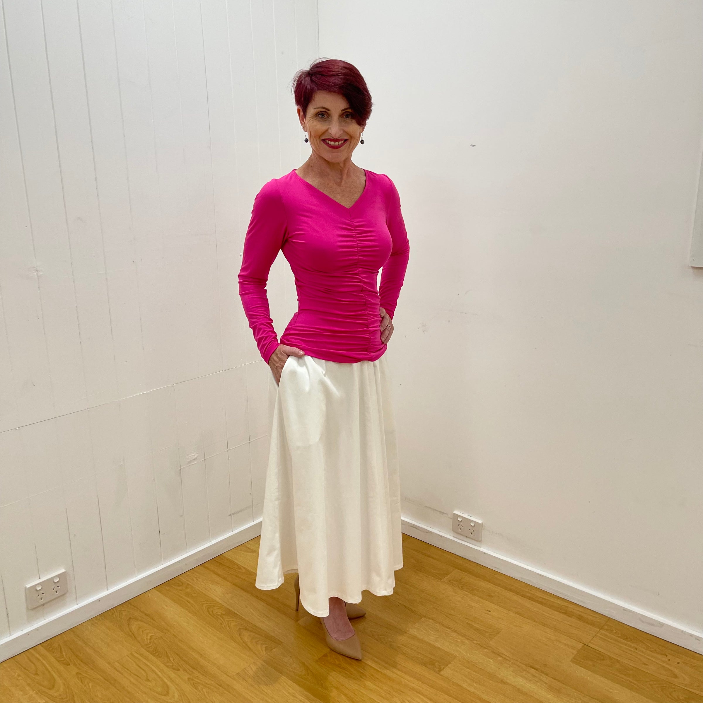 White cotton sateen half circle midi skirt. fitted waistband. centre back zipper. fully lined.