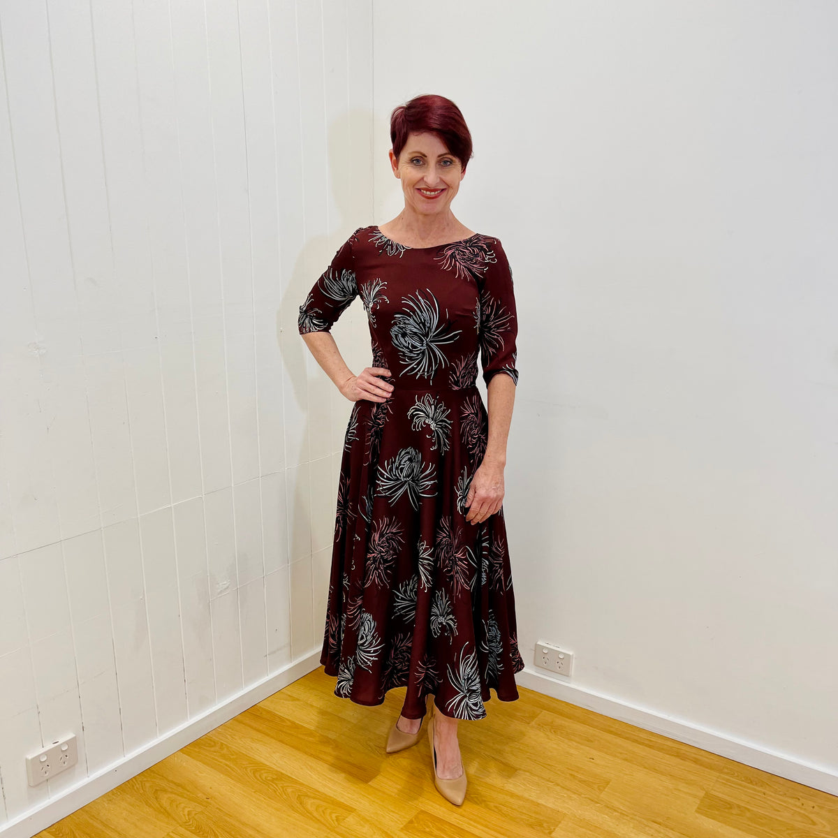 Red Earth Floral Print fully lined ankle length full circle dress. Elbow length fitted sleeve. Fitted through the waist with elastic through the back seam. Side seam invisible zipper.